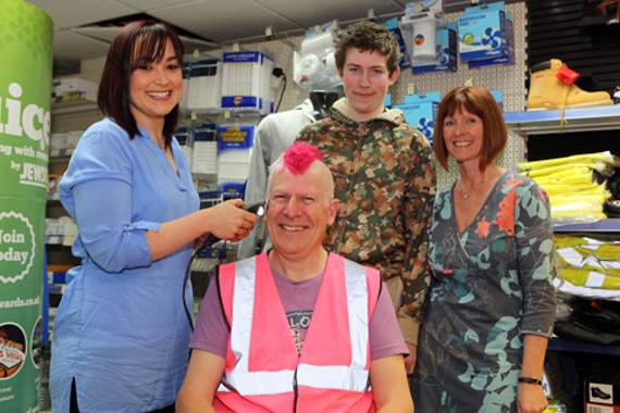 Scott styles hair into pink mohican for Autism Awareness Week