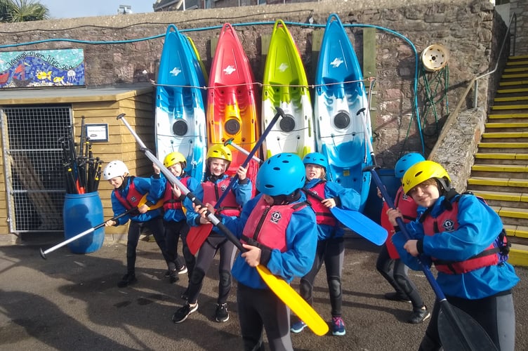 Youngsters with kayaks