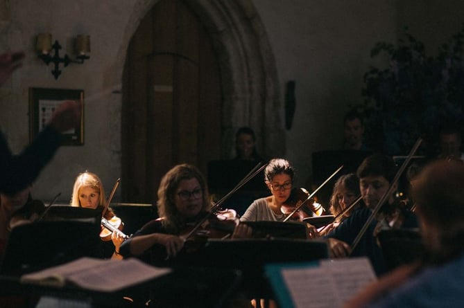 Summer School students performing in the Great Hall