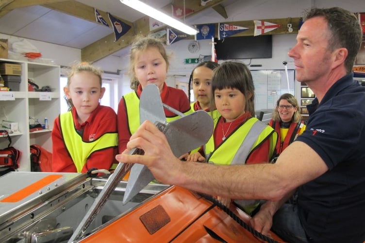 Totnes St John’s Primary pupils Sophia, Mia, Keziah and Bella with Dart Lifeboat helm, Kevin Murphy