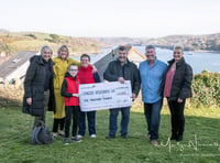 Rotary club presents cheque to Cancer Research UK