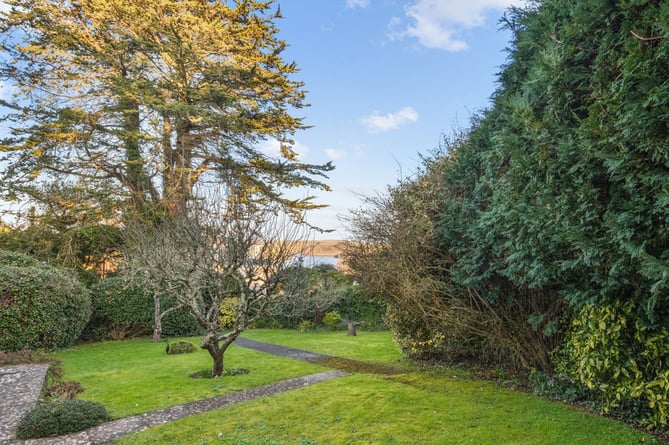 Mature garden surrounding the 1970s house in Salcombe, Devon. See SWNS story SWLNhouse. An incredible 'time warp' 1970s home with original patterned wallpaper, lino and apricot tiles has gone on the market - for Â£1million. The four bedroom property was originally built in the seventies and has been with the same owners for almost 40 years. The house is described as being "ready for modernisation" but some 70s fans may want to leave the decor exactly as it is.