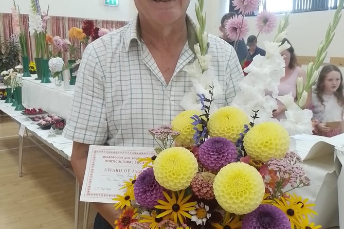 Terry Reeves with his award-winning flowers