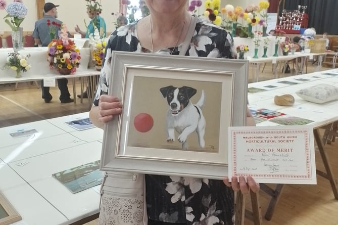 Rita Fairchild with her award-winning art