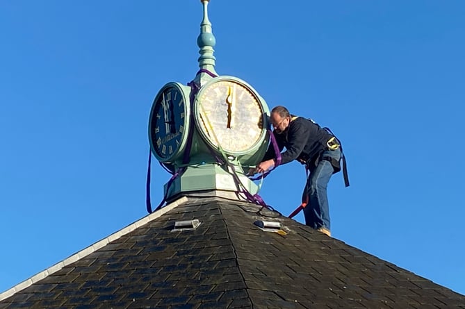 Patrick Elliott installing the TIC clock 