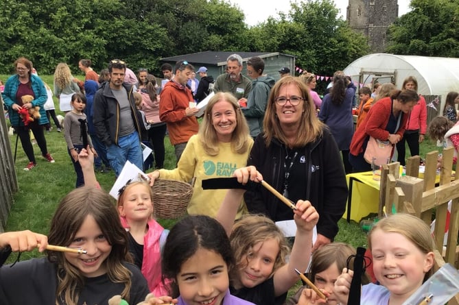 Children, parents and children enjoy the fete