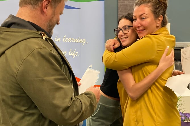 Students celebrate their A-Level results and their hard-earned success