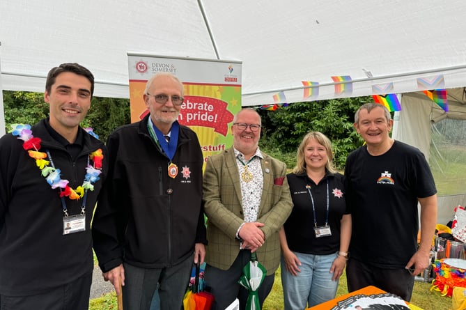 Fire Pride and Exeter Pride representatives with, centre, the Lord Mayor of Exeter, Cllr Kevin Mitchell and Cllr Simon Coles, chair of the Devon and Somerset Fire and Rescue Authority, second left.  AQ 1956
