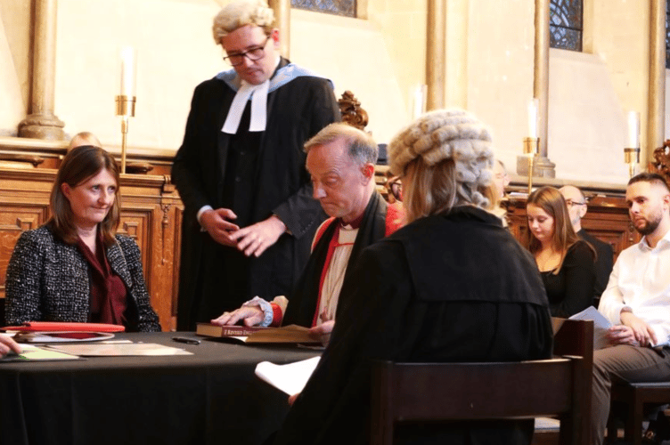 The new Bishop of Exeter signing an oath.