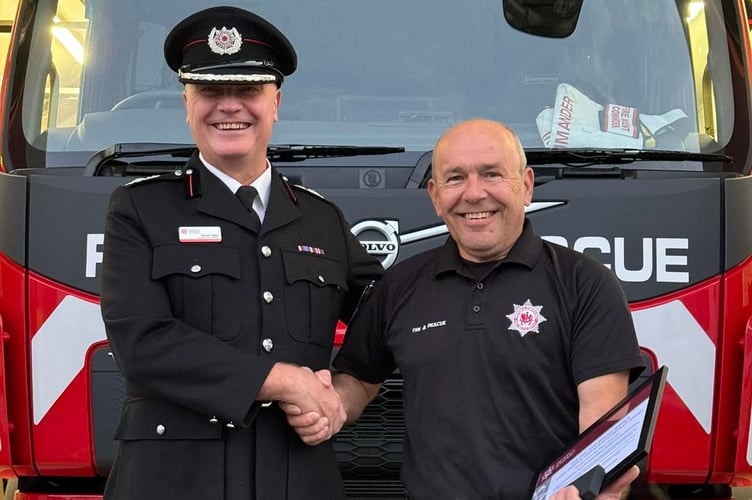 Assistant Chief Fire Officer Gerald Taylor presented the station’s Watch Manager Dave Harvey with The Fire and Rescue Service Long Service and Good Conduct Medal Thirty Years of Service Clasp