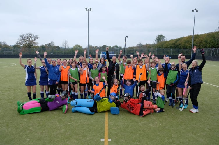 Bishop Mike with some of the members of Tiverton Hockey Club.
