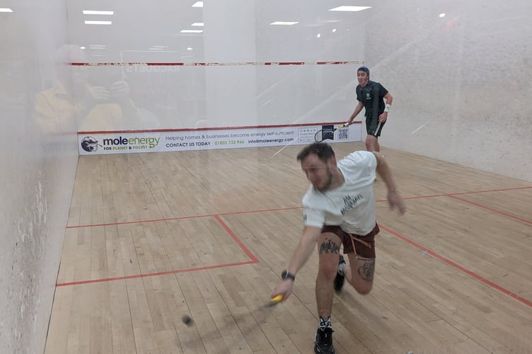 James Casey of Kingsbridge superb backhand drive whilst Pocock looks on