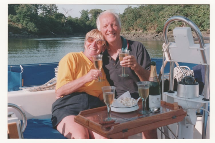 Barbara and Mike share some champagne