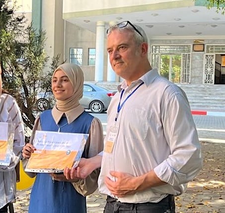 14-year-old Roqaya, seen here posing proudly next to Mr Bilbrough, was killed by an Israeli strike last November