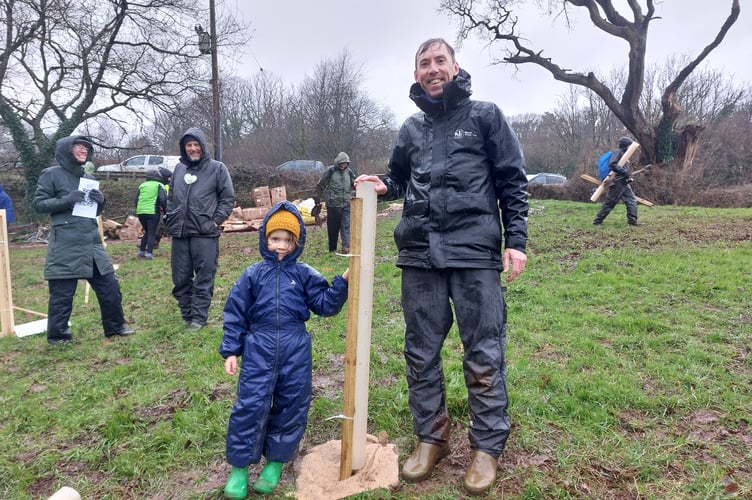 Devon Wildlife Trust CEO Nick Bruce-White with five-year-old Phoenix, who planted the first tree